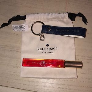 Kate Spade. Navy key chain & roller. Never used. Comes with bag. Excellent cond